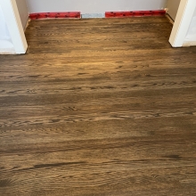 Original floor - red oak, closet in one bedroom did not have hardwood. Patched in the missing wood, and the sanded everything and finished it with a custom Bona 2K craft oil blend. 
