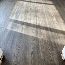 Original floor - red oak, closet in one bedroom did not have hardwood. Patched in the missing wood, and the sanded everything and finished it with a custom Bona 2K craft oil blend. 