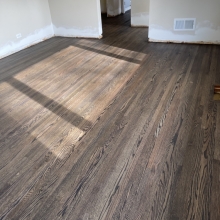 Original floor - red oak, closet in one bedroom did not have hardwood. Patched in the missing wood, and the sanded everything and finished it with a custom Bona 2K craft oil blend. 
